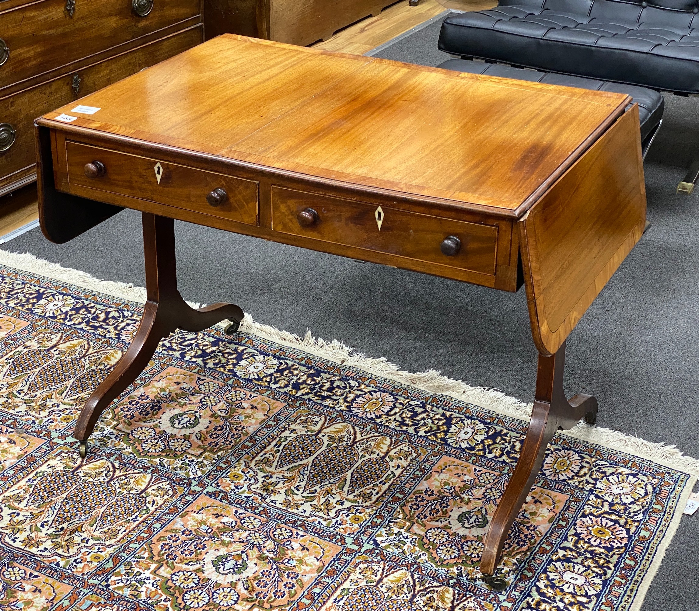 A Regency mahogany and satinwood banded sofa table, width 86cm, depth 60cm, height 67cm